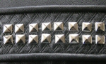 Detail of studs on quilted background - click to enlarge